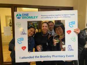 Attendees from the Bromley Cross Sector Pharmacy Networking Event inside a giant photo frame