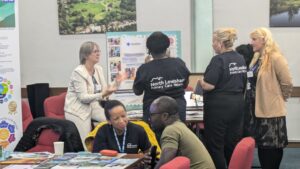 Neighbourhood 3 Community Cafe stall with attendees sharing information